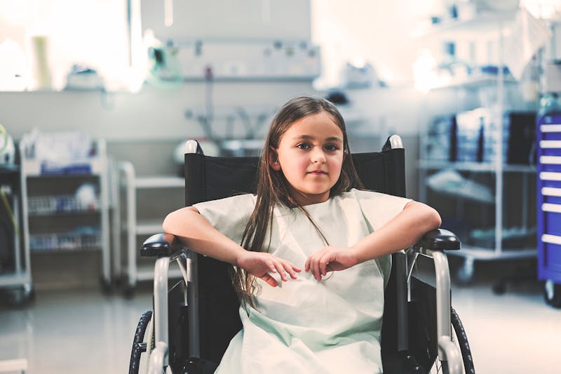 likttle girl in wheelchair