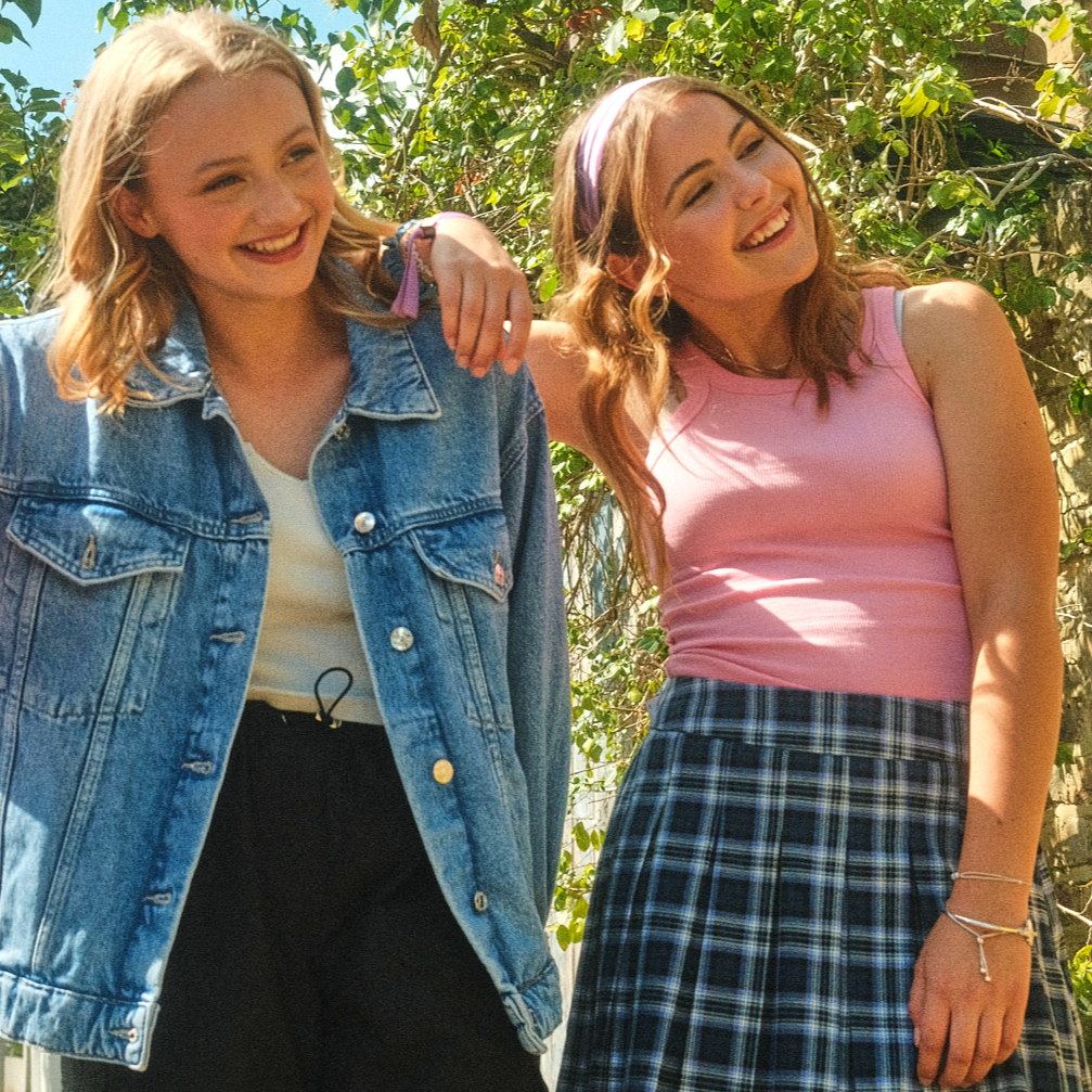 group of 2 smiling teen girls posing for a photo