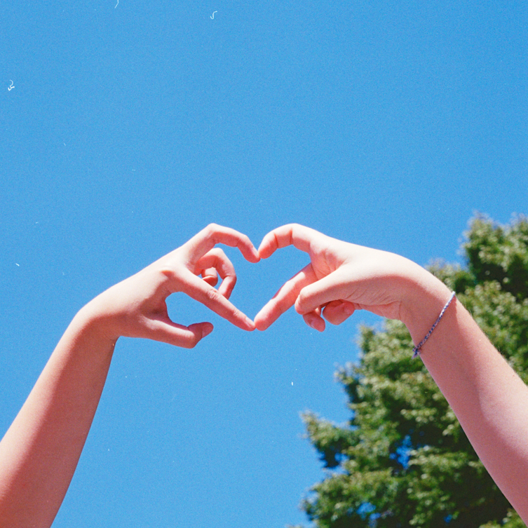 two hands creating a heart shape