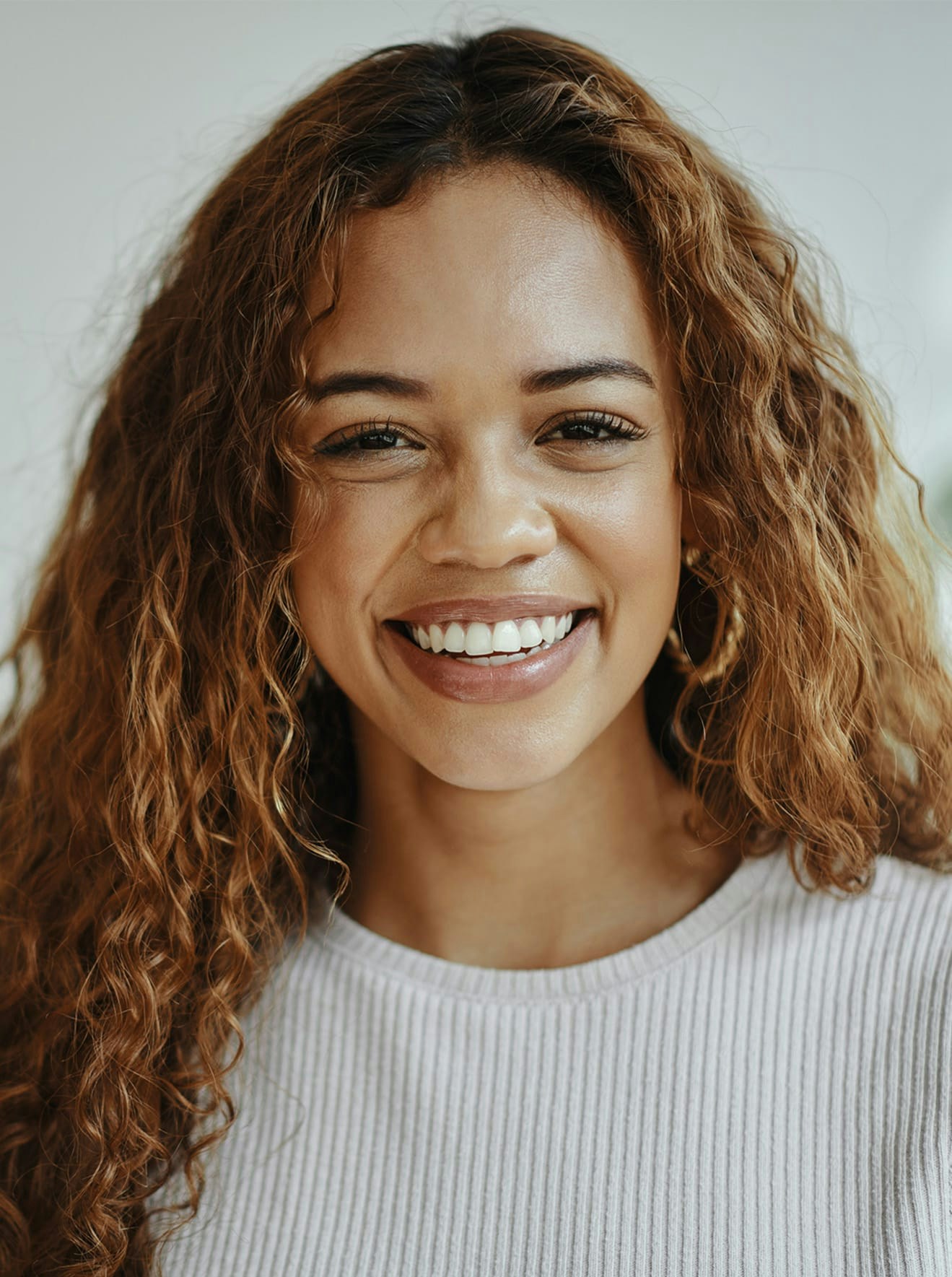 Woman in white shirt smiling