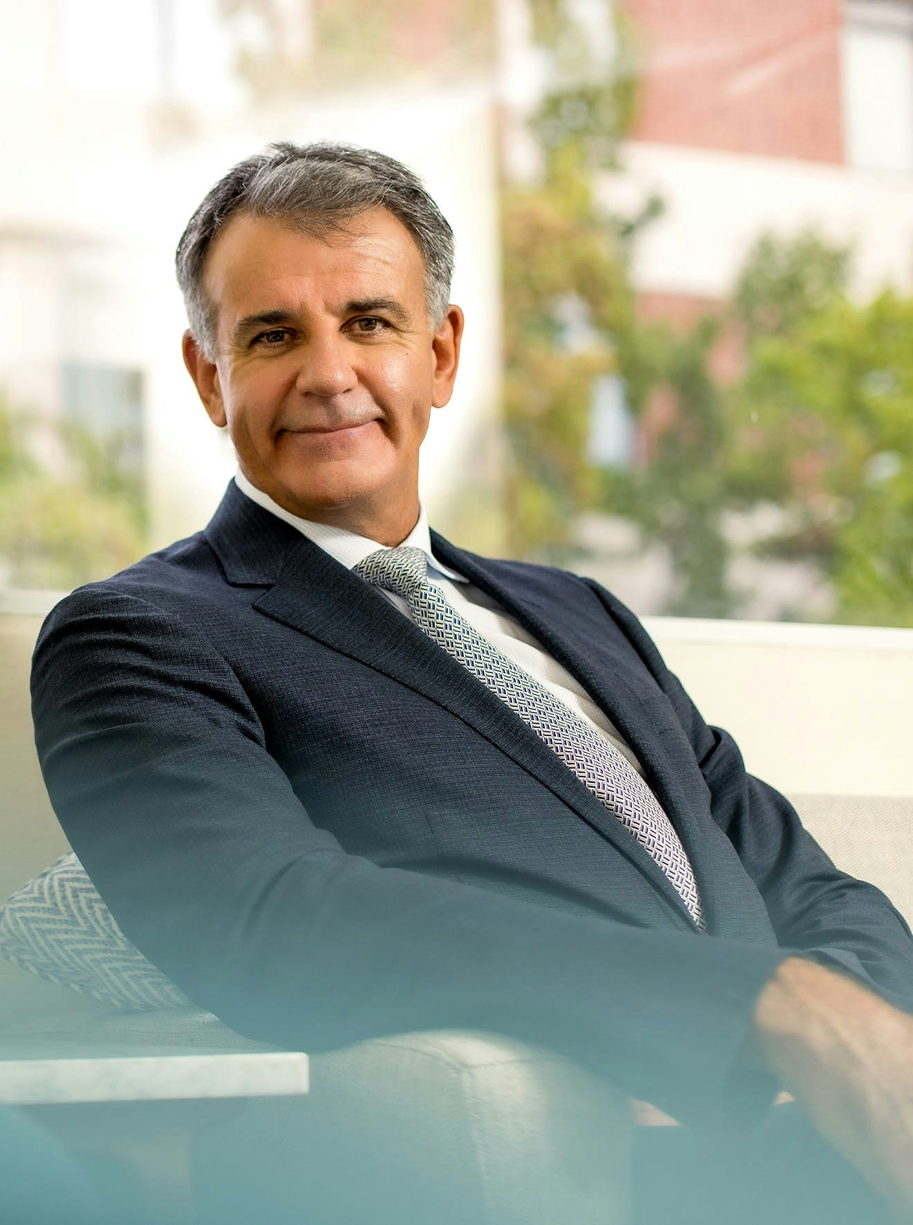 Dr. Glynn Bolitho sitting in suit