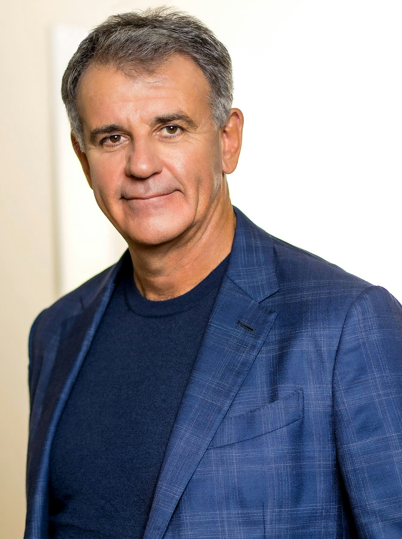 Dr. Glynn Bolitho in blue shirt and blue blazer