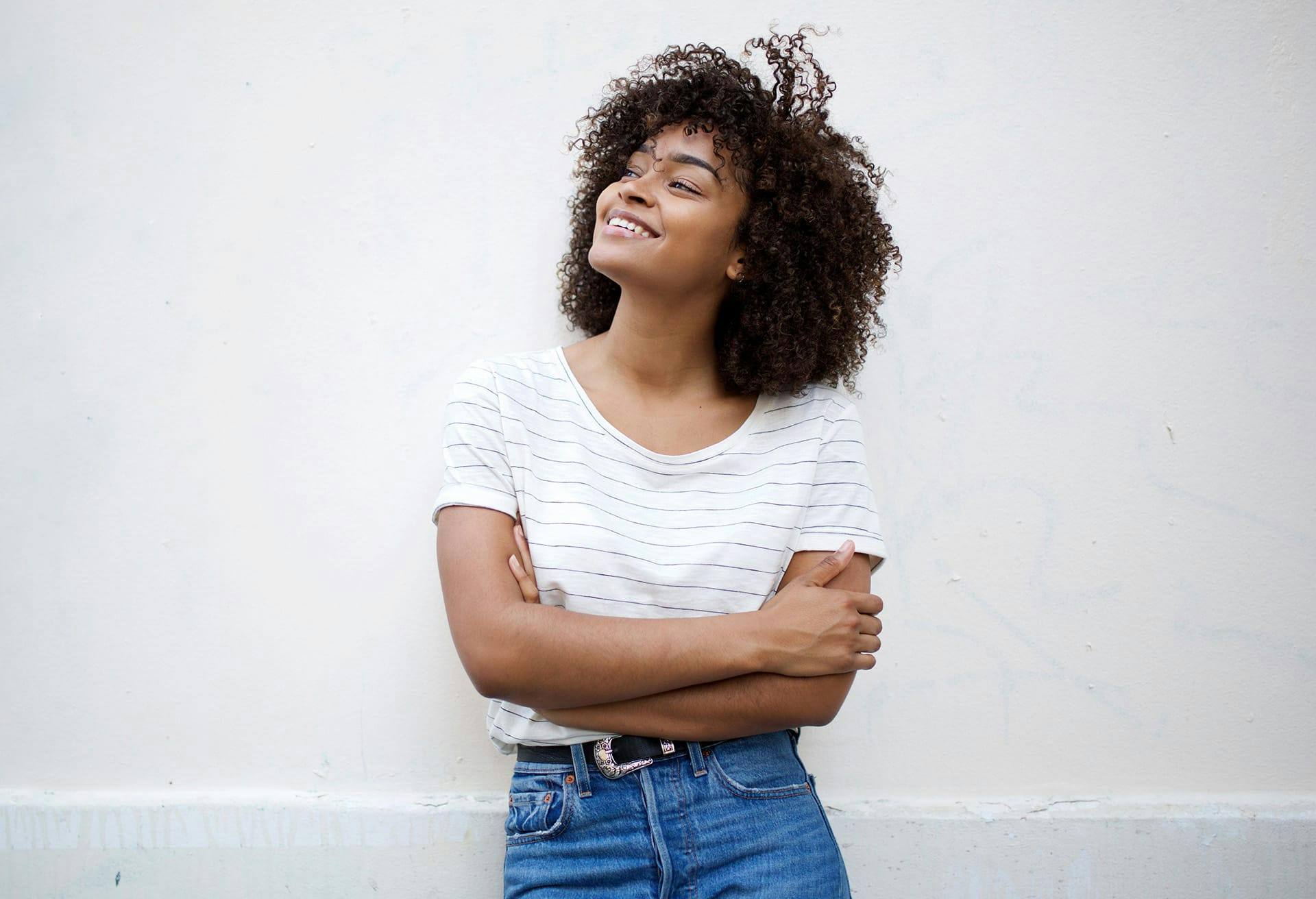 Woman smling and holding arms