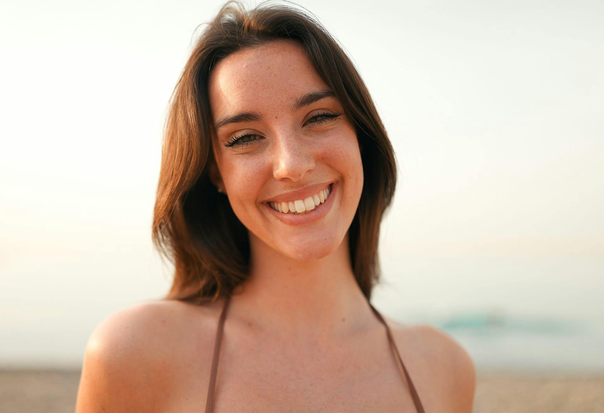 Close up of woman in bikinni top smiling