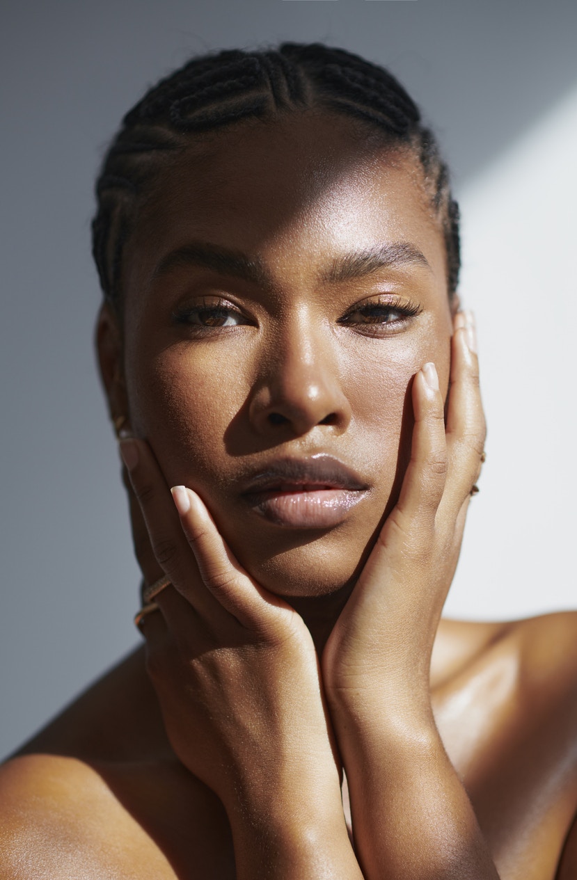 Woman touching her face