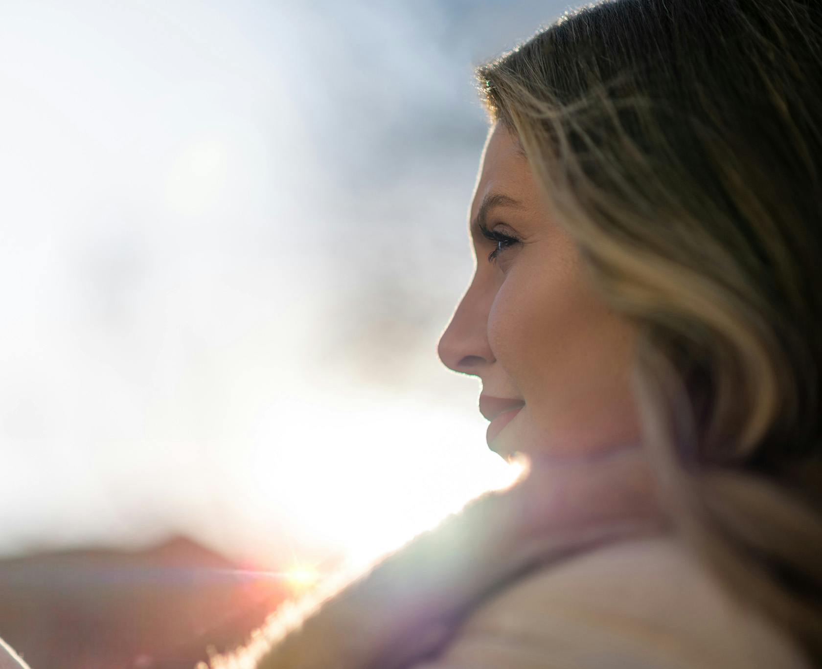 blond woman looking out into the distance