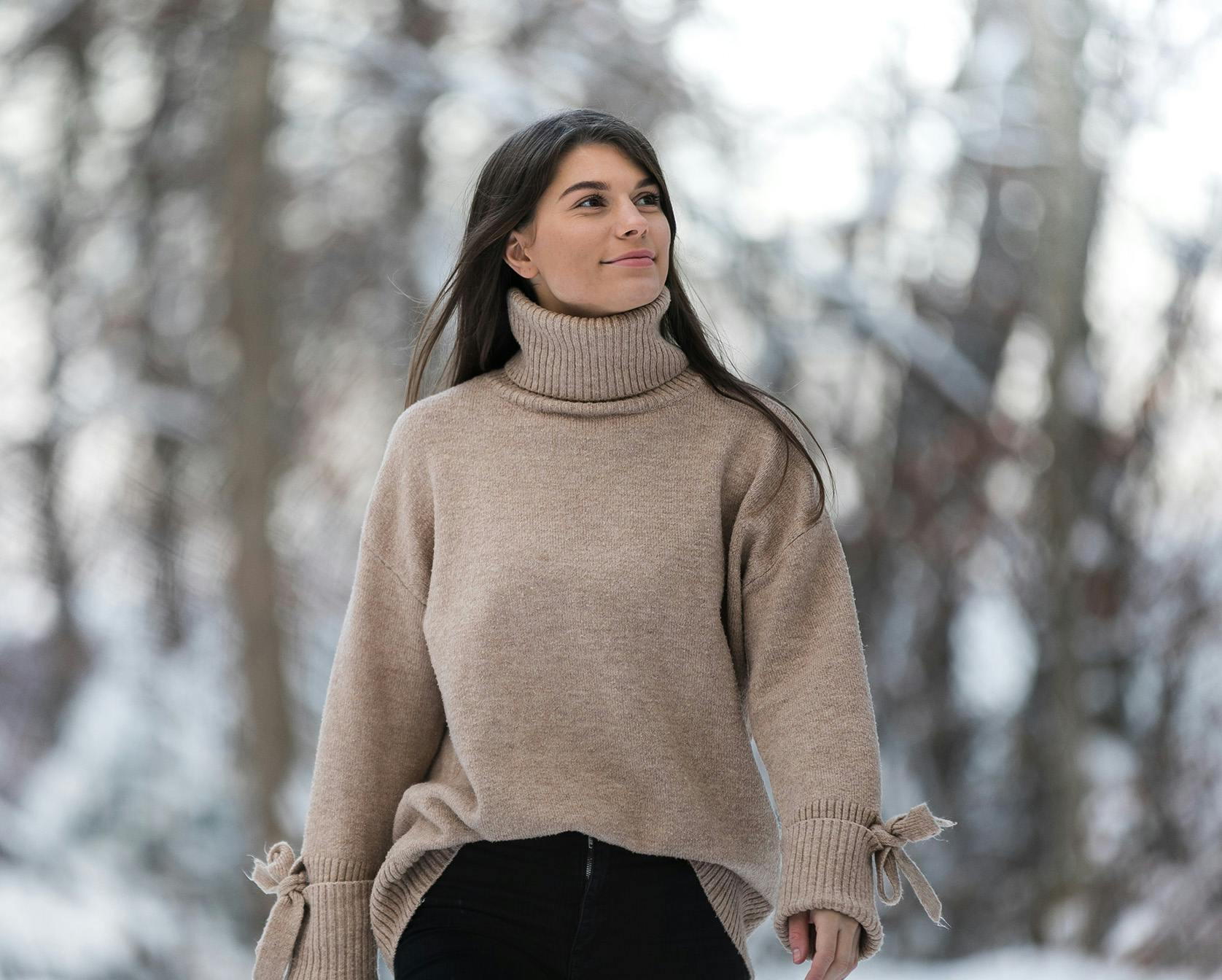 Brunette woman in turtleneck sweater