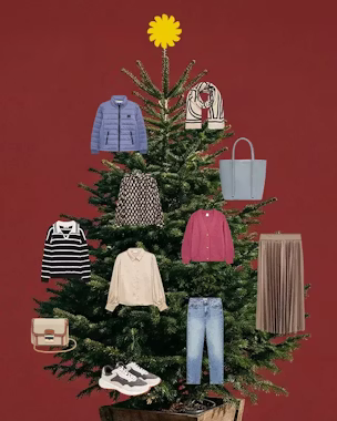 A Christmas tree with various garments hanging from it, as if they were garlands.