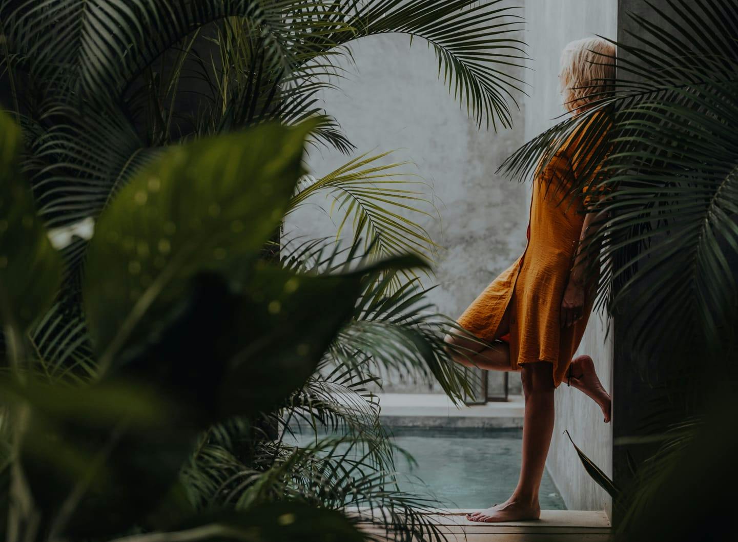 Woman leaning against a wall