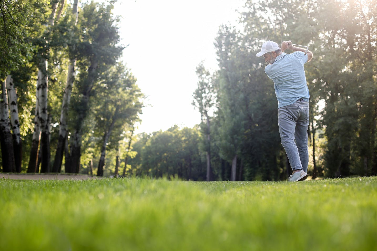 mid-swing on the fairway