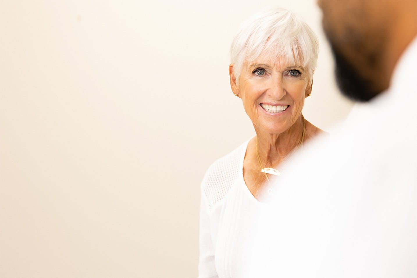 Woman smiling at a manv