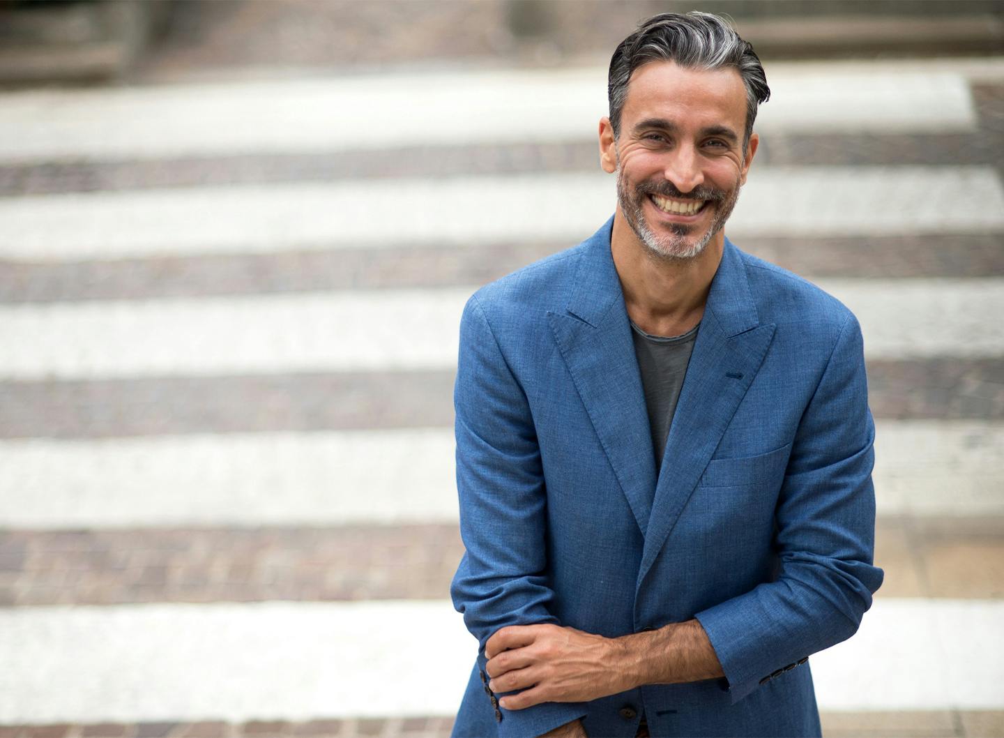 woman with hand on side of face