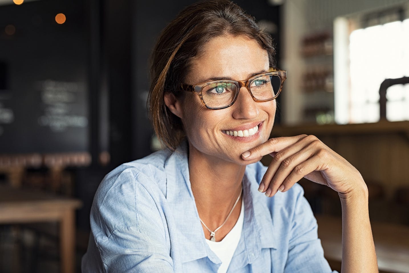 lady smiling towards window