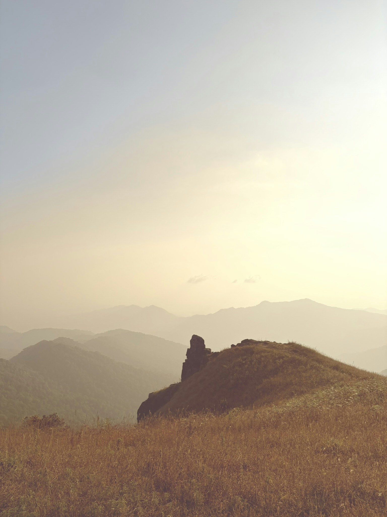stone on top of a hill, sunset, ISO 32, f1.6, 1/12000s