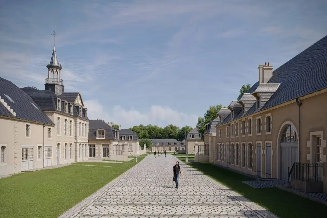 Immeuble ancien de prestige entièrement réhabilité dans le cadre d'un investissement locatif en loi Malraux, entouré d'espaces verts et d'une allée pavée.