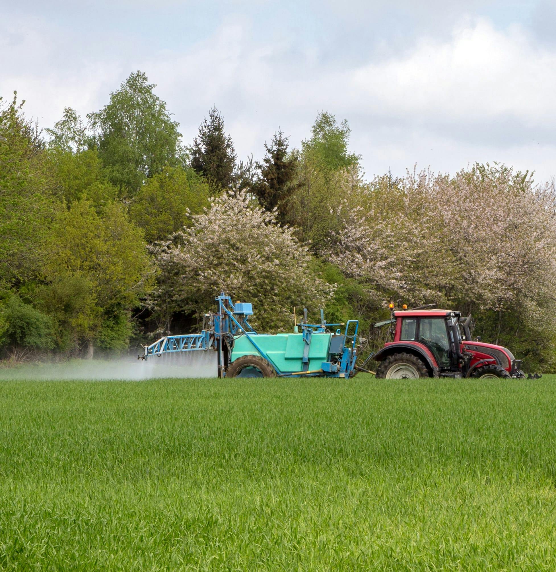 Field being sprayed with chemicals