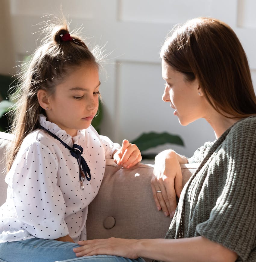 unhappy girl talking to her mom