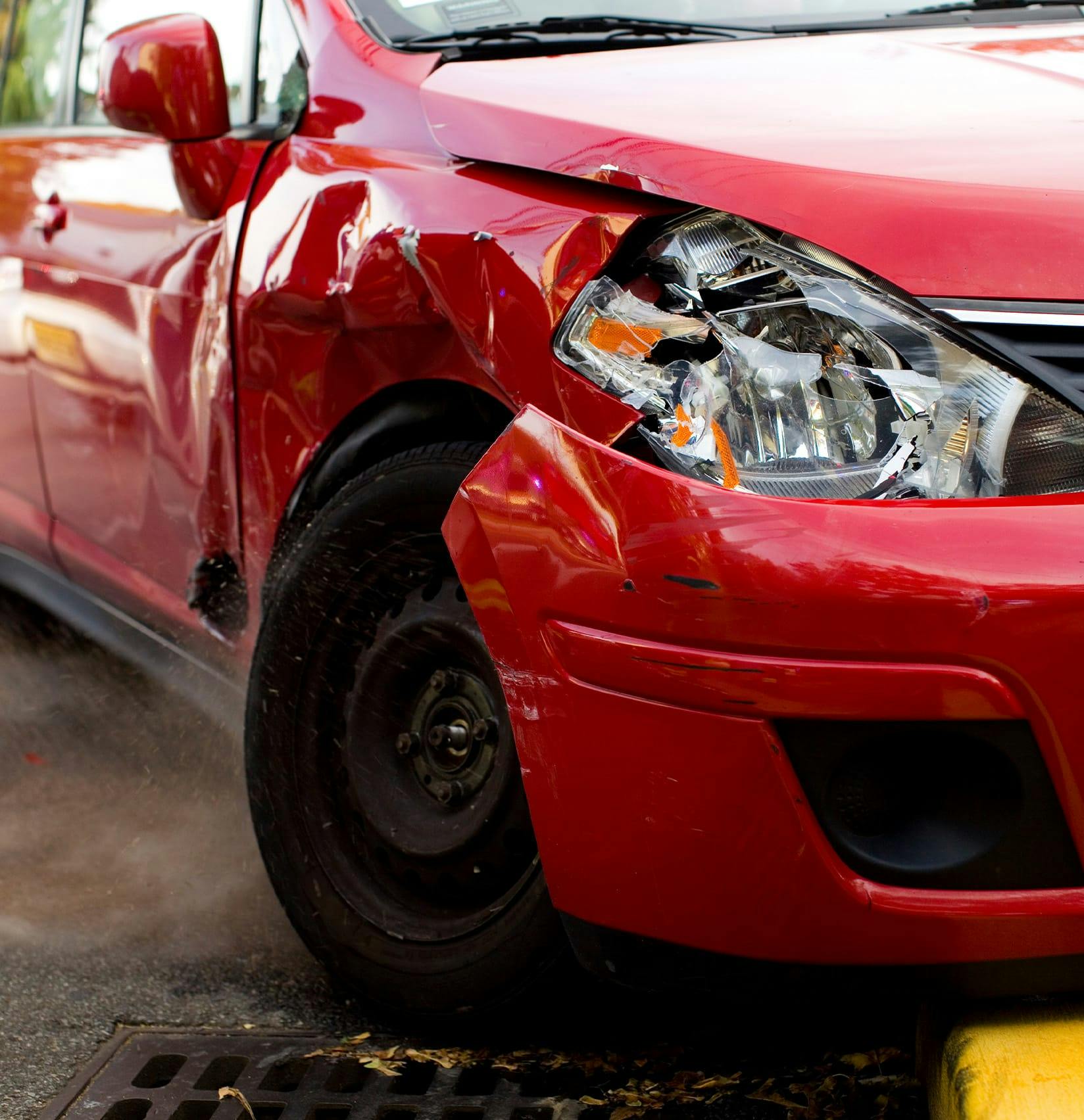 Crashed front end of a red car