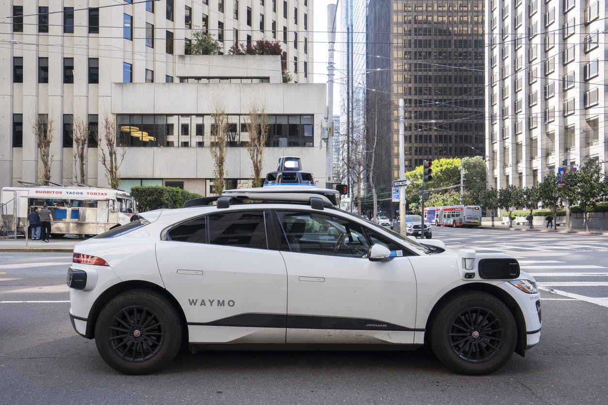 A Waymo driving on a street