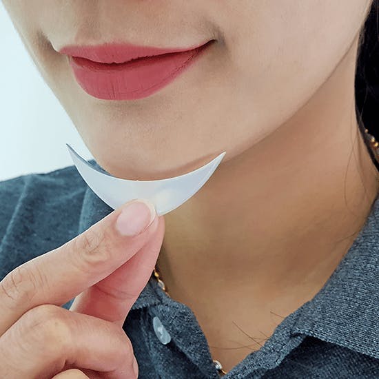 Woman holding a Chin Implant 
