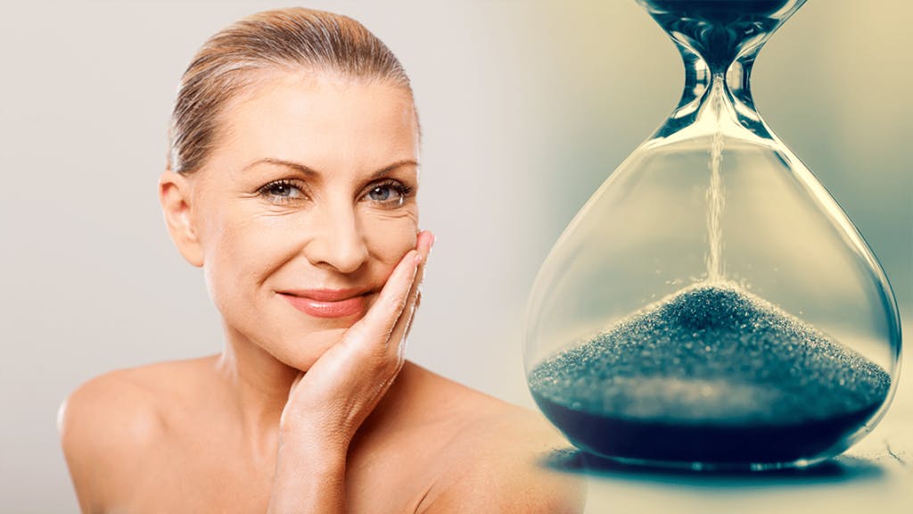 Middle age woman and hourglass representing how long an aesthetic procedure last.