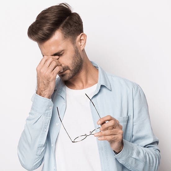 Man wearing glasses after rhinoplasty . Stock image.