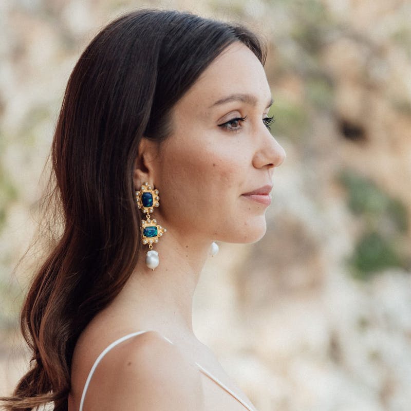 woman wearing big earrings