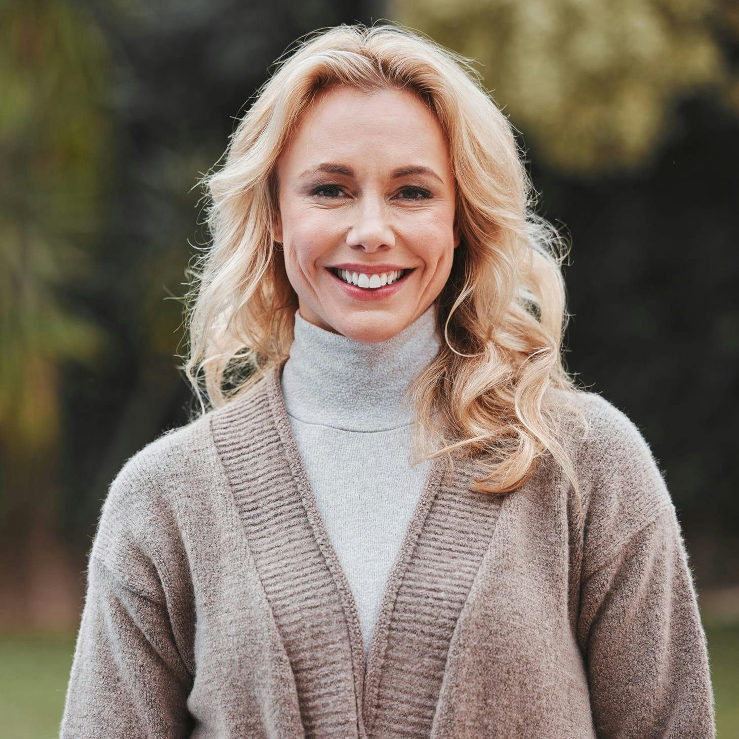 woman in a brown sweater