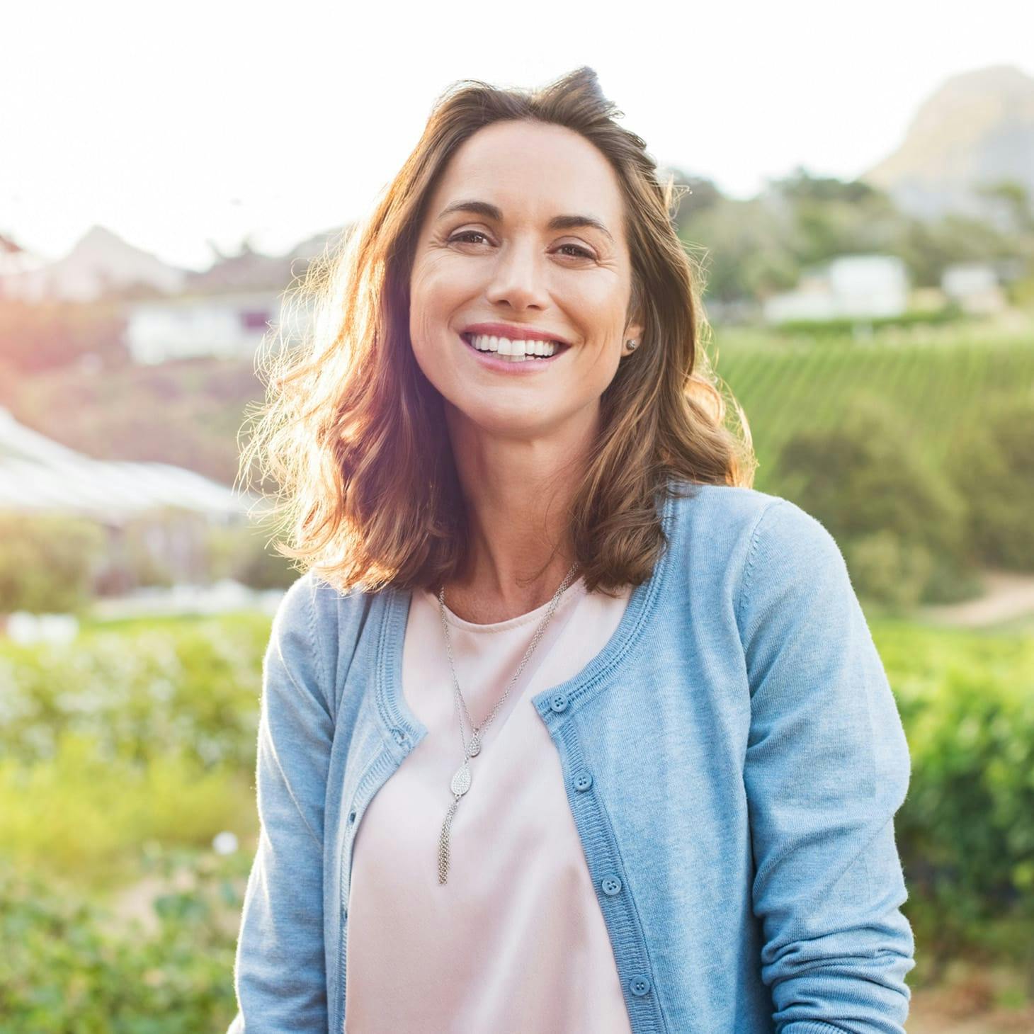 woman in a blue cardigan