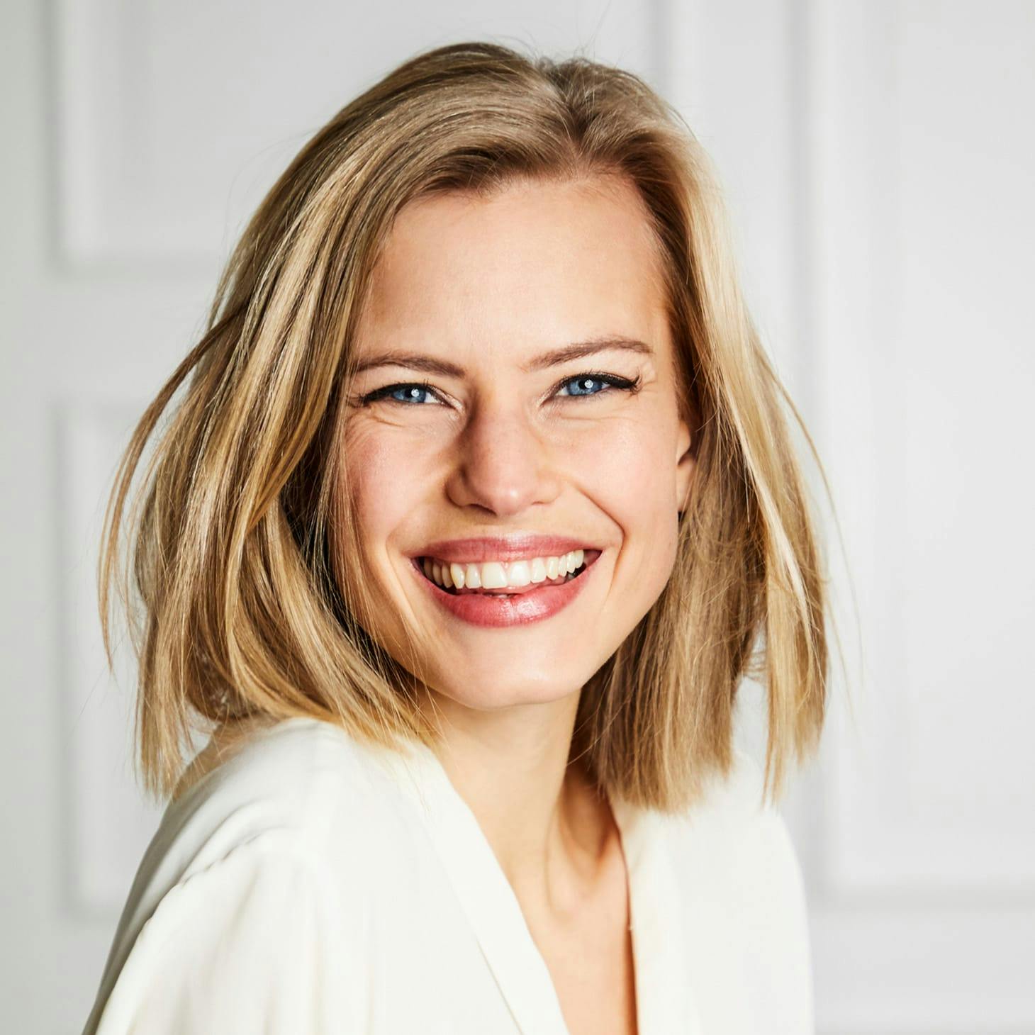 woman with blonde hair smiling