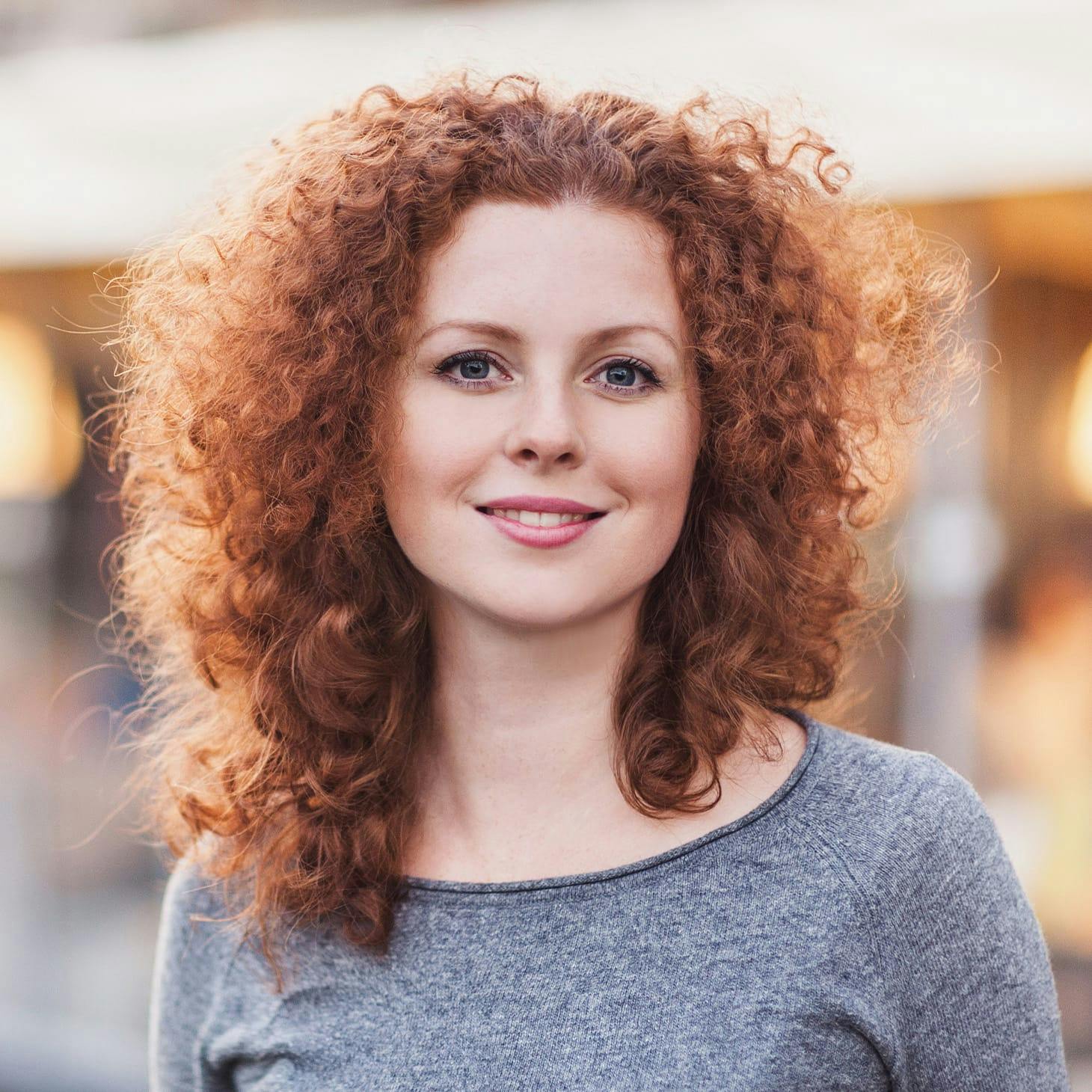 woman with red curly