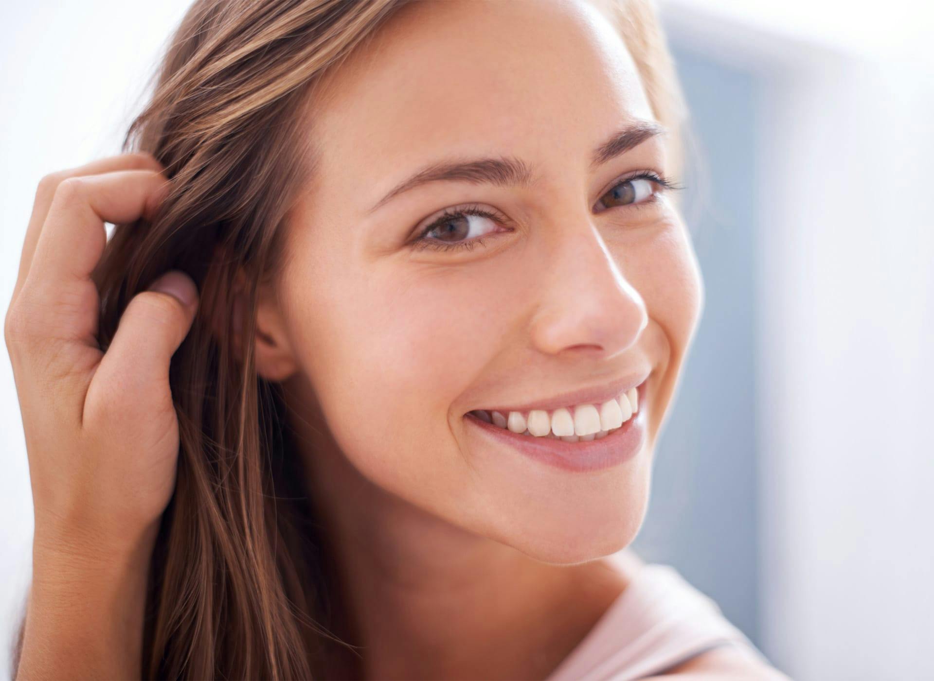 woman touching her hair