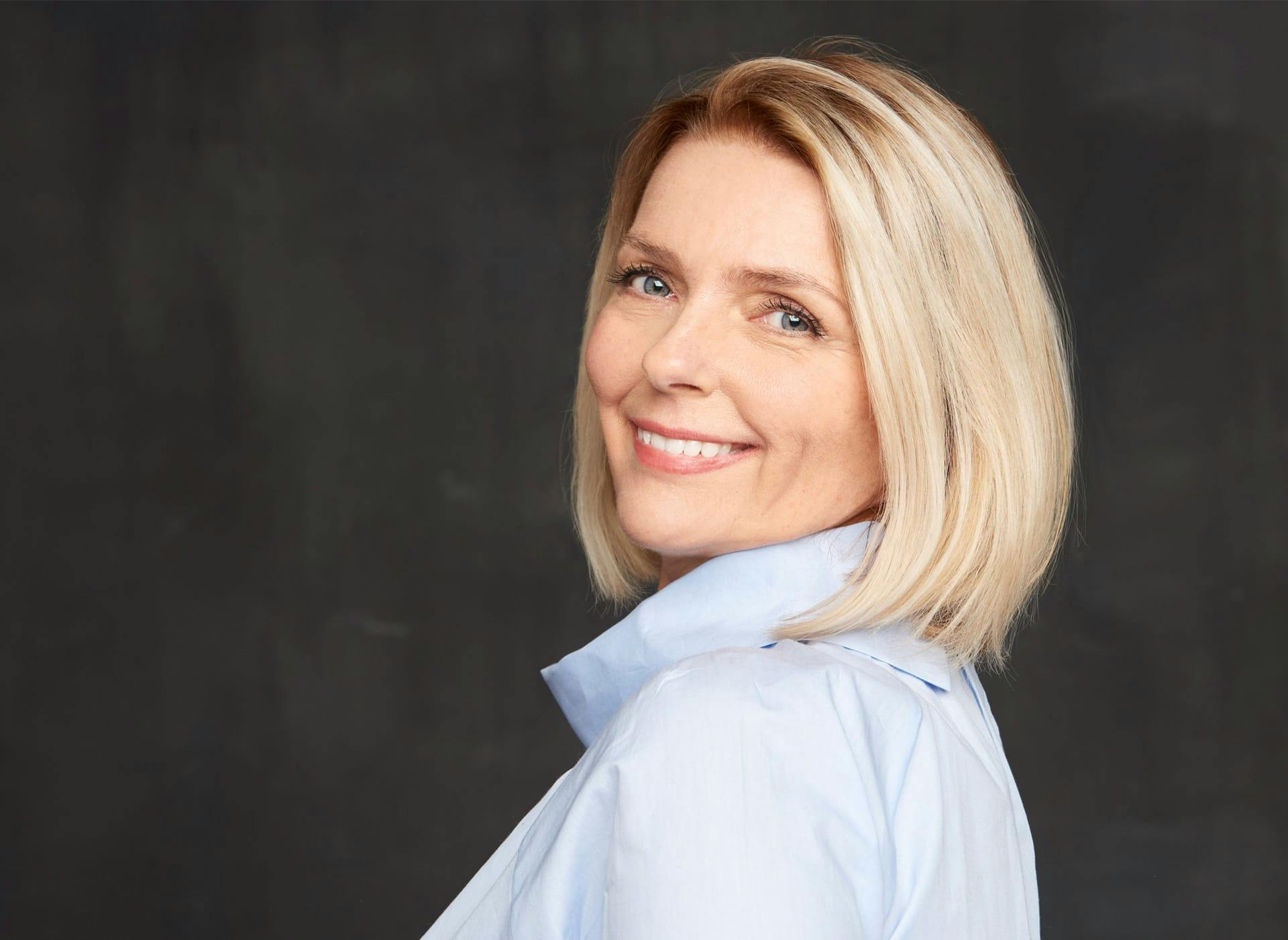 woman smiling looking over her shoulder