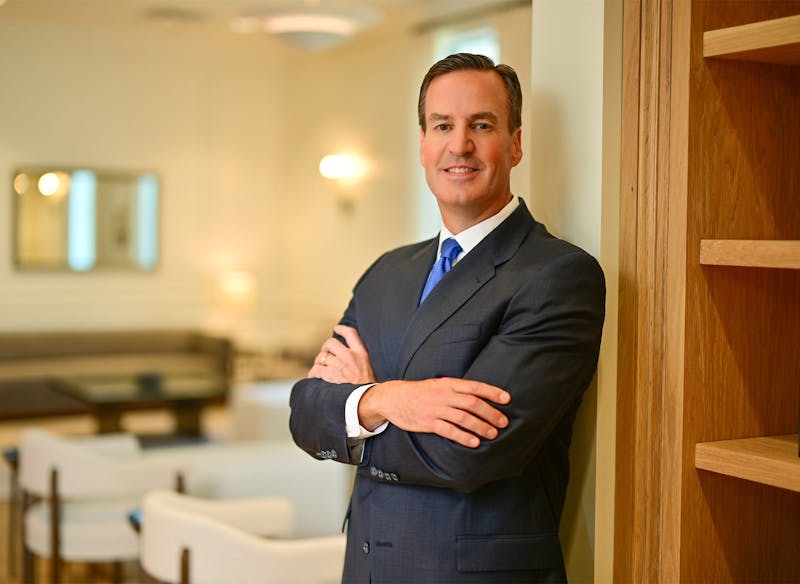 Dr. Edward Buckingham standing with his arms crossed