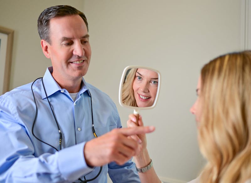 Dr. Edward Buckingham with a female patient