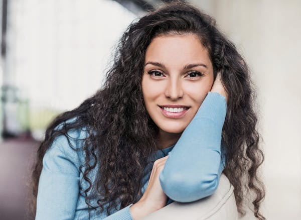 woman with long curly dark hair
