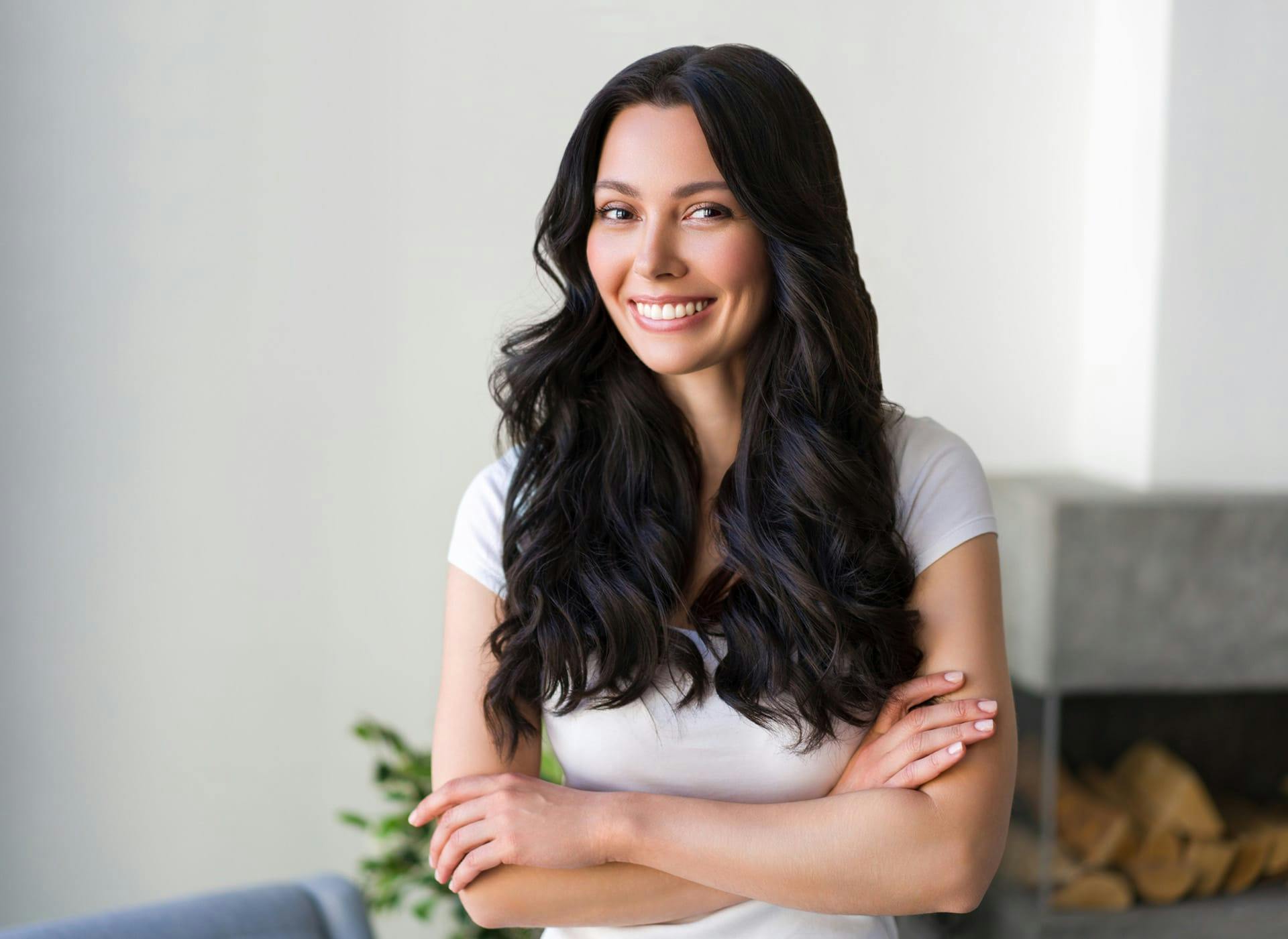 woman with long dark hair smiling