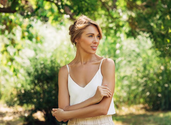 woman in a white top