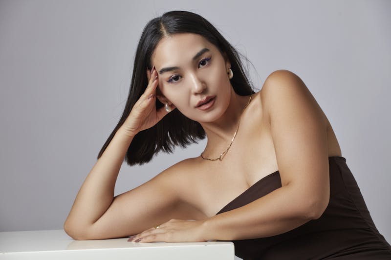 Woman resting her head on her hand