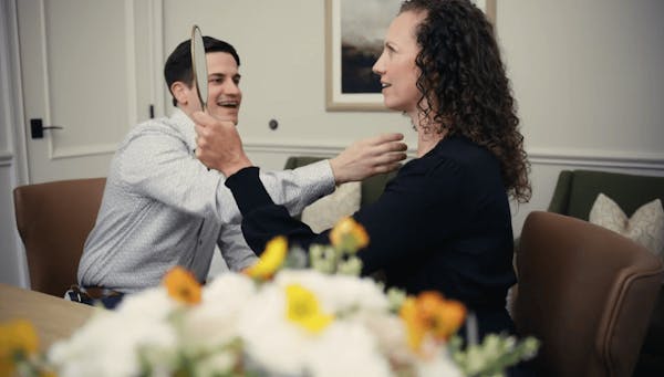Doctor Showing Patient her Facelift Results