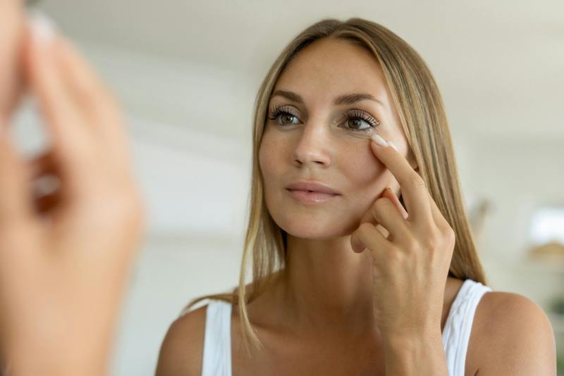 Woman touching her face