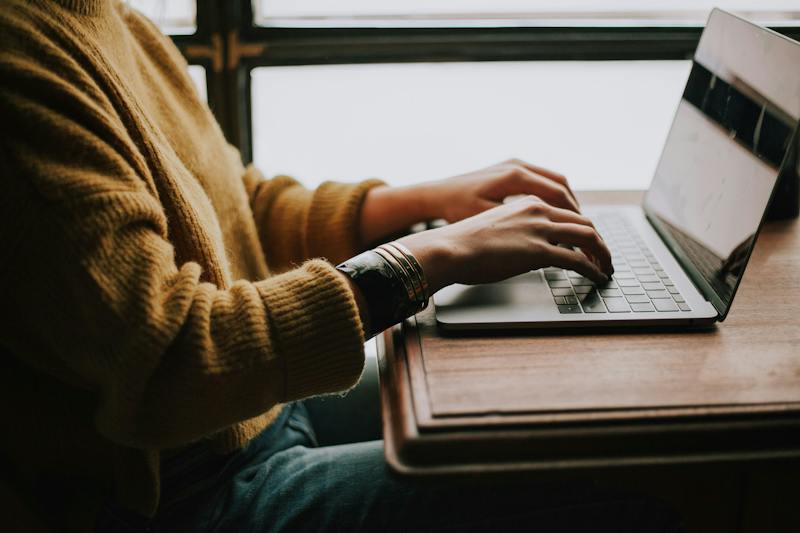 Person requesting a copy of their stored personal data on a laptop (Photo by Christin Hume on Unsplash)