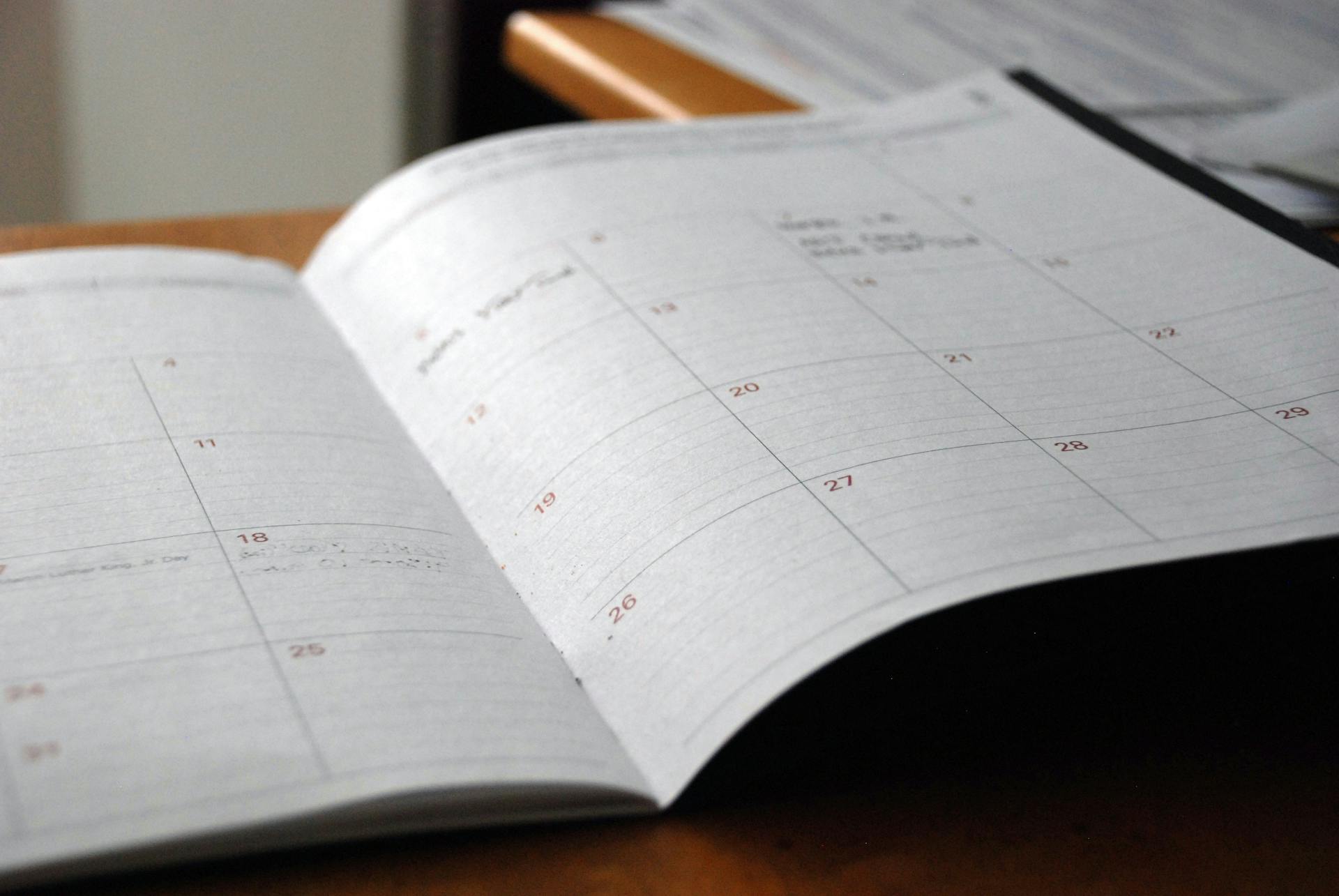Open monthly planner on a desk used to track deadlines (Photo by Eric Rothermel on Unsplash)