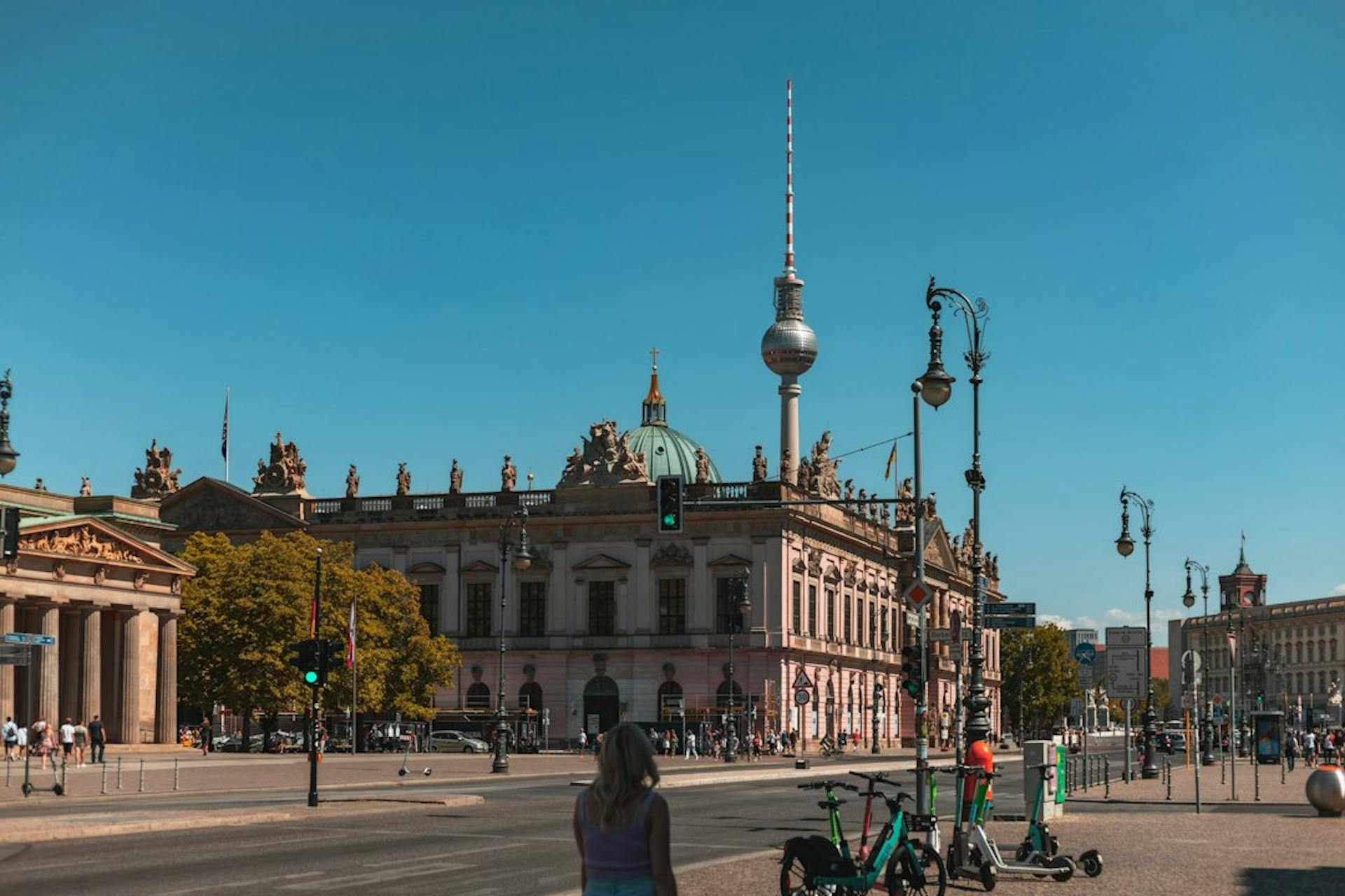 Berlin TV tower behind historic buildings on a sunny day (Photo by Yahya Momtaz on Unsplash)