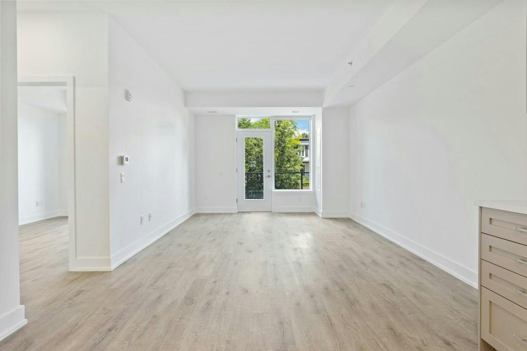 Empty bright apartment with wooden floor ready for handover (Photo by Point3D Commercial Imaging Ltd. on Unsplash)