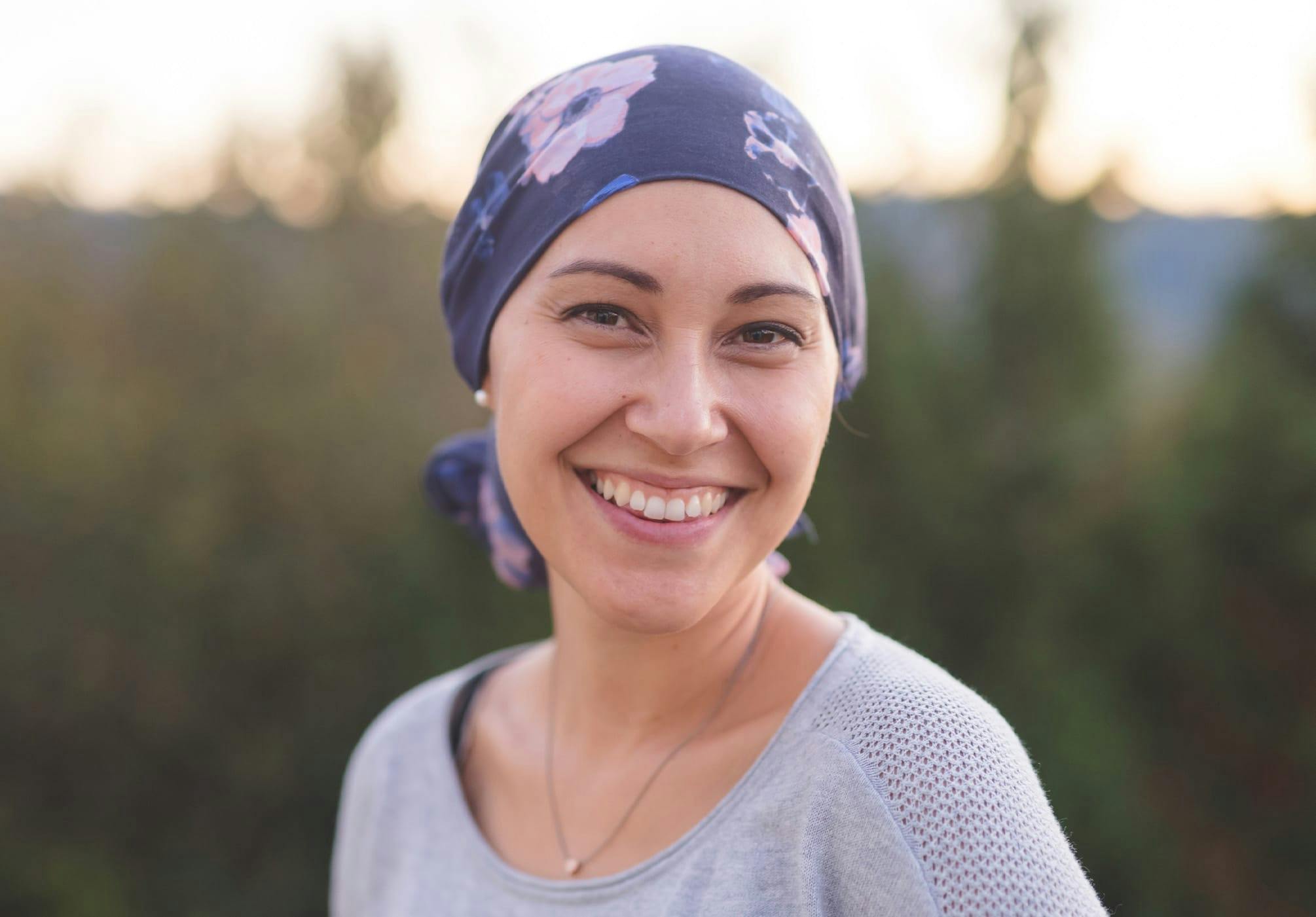 woman wearing a purple floral head scarf