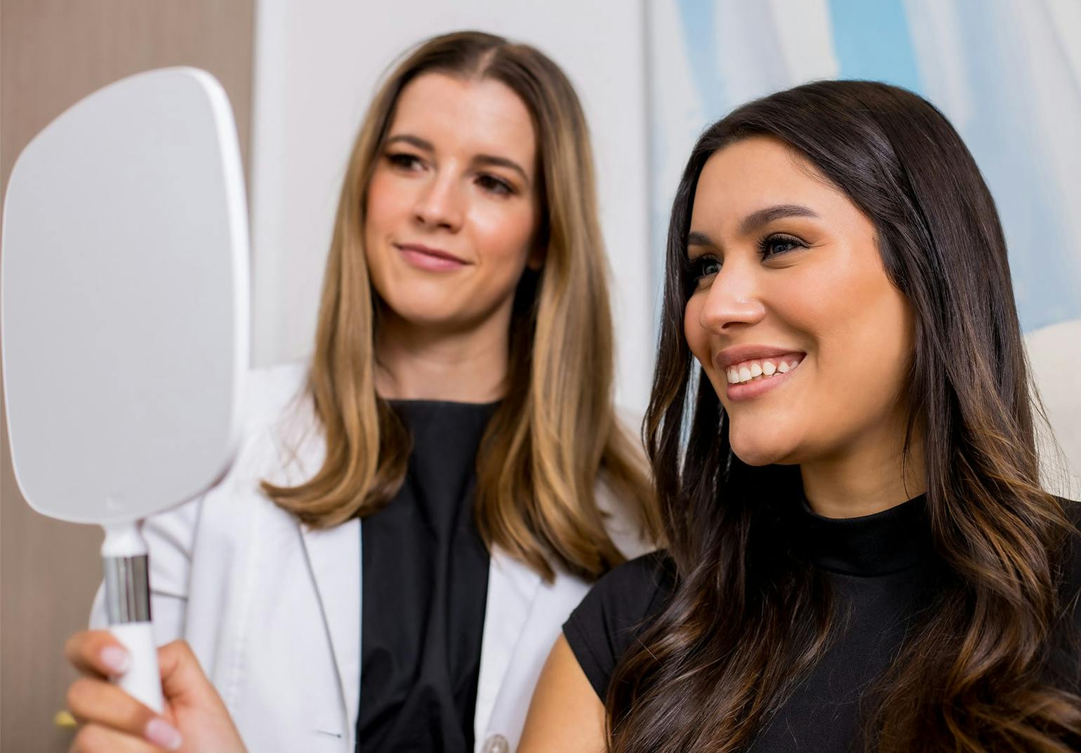 Woman holding a mirror