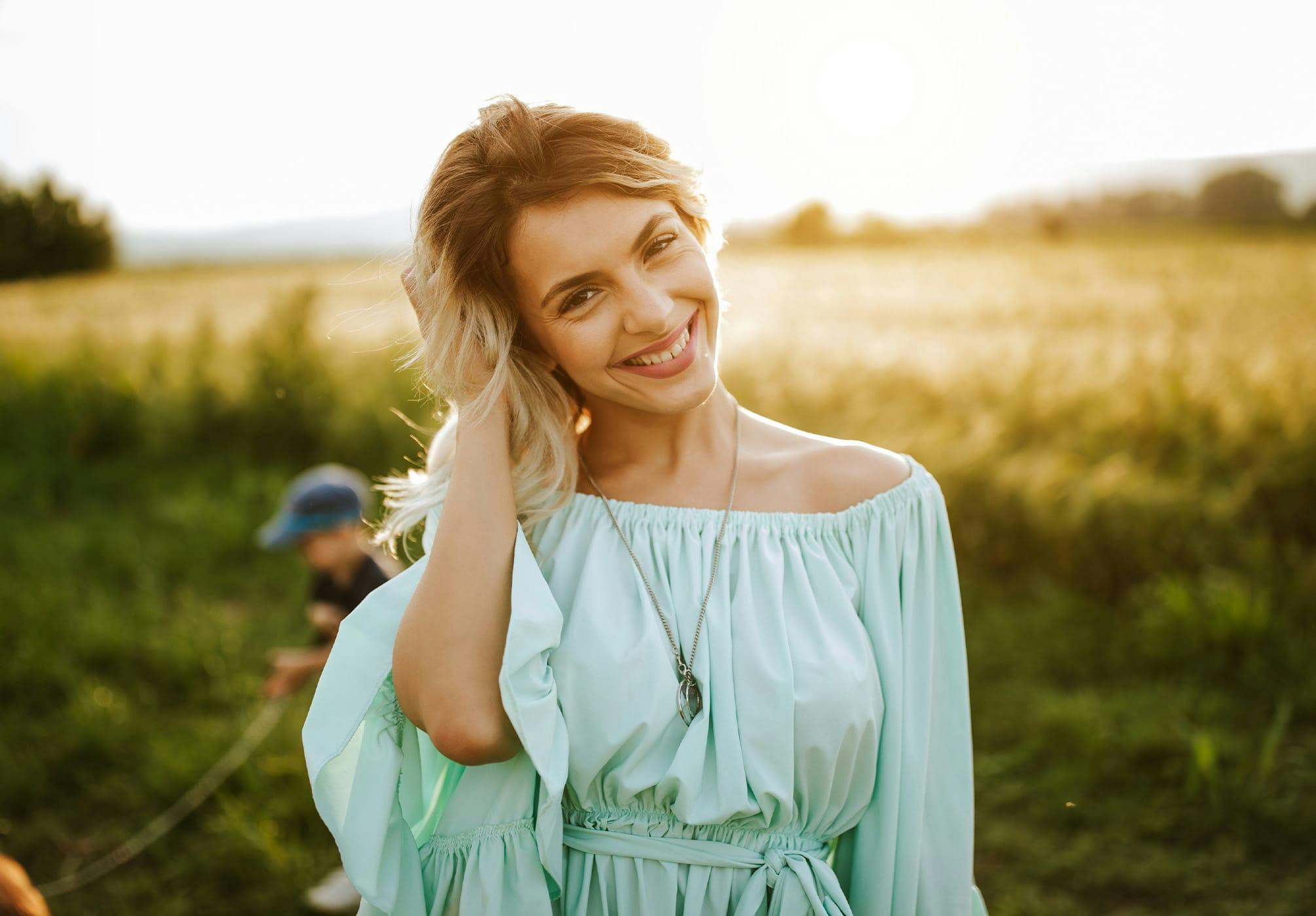 Woman in a teal dress