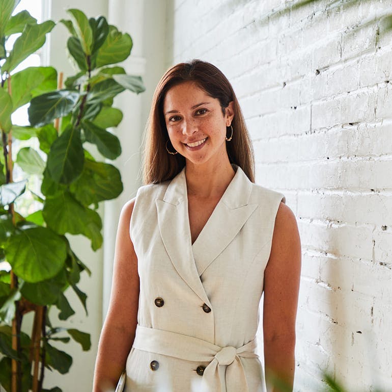 woman in a white coat