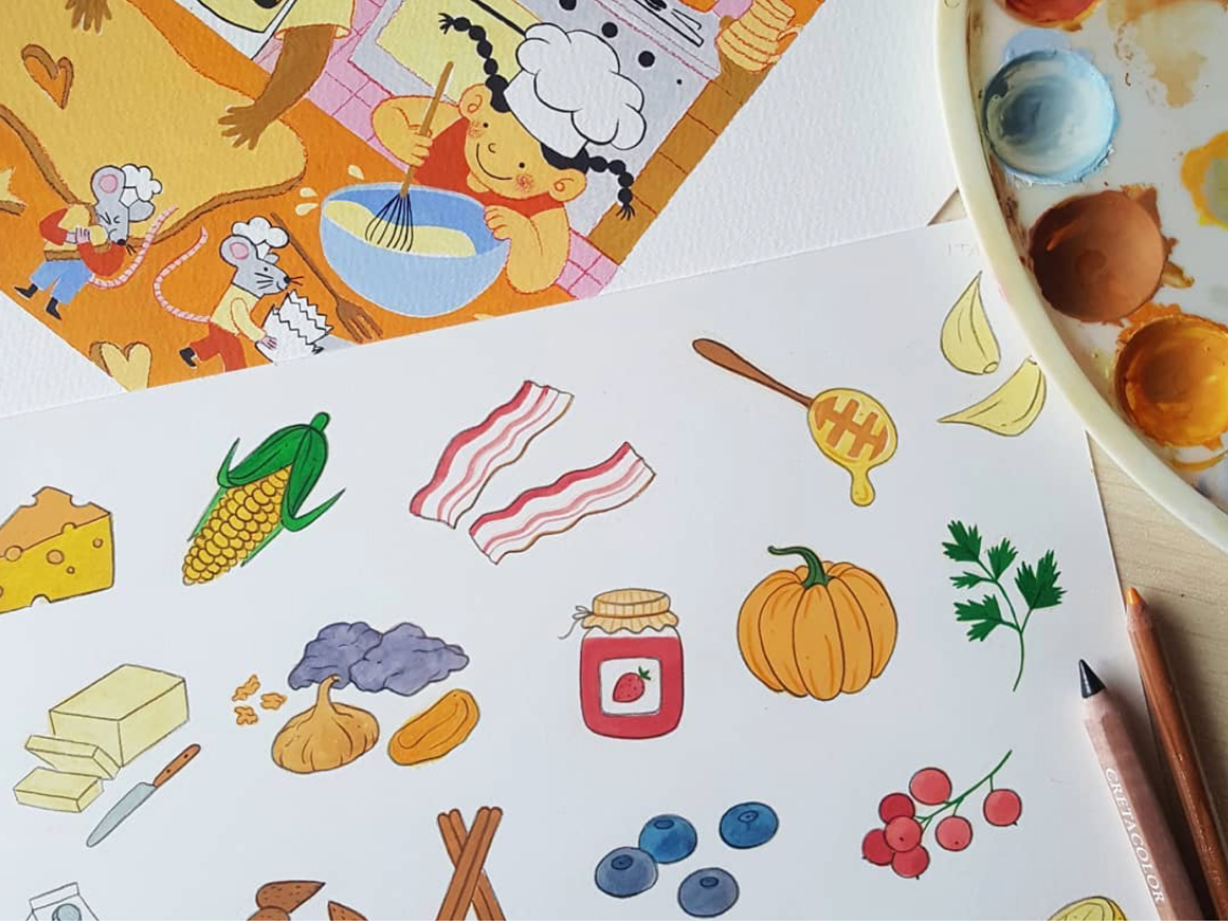 Fotografija dveh ilustracij s hrano, zraven paleta z barvami
